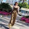 8 Potret Cinta Laura Padukan Outfit Off-Shoulder Motif Lurik dengan Celana Kulot Emas, Cantik dan Kece Abis!