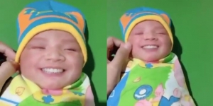 Narsis Sejak Lahir, Bayi Ini Ketahuan Kasih Senyum Lebar di Depan Kamera