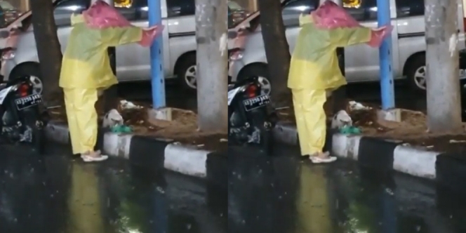 Hujan Deras, Wanita Ini Payungi Kucing yang Sedang Makan di Pinggir Jalan