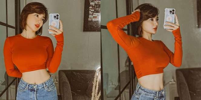 Sederet Mirror Selfie Wika Salim Pakai Crop Top Oranye, Pamer Body Goals Bak Gitar Spanyol