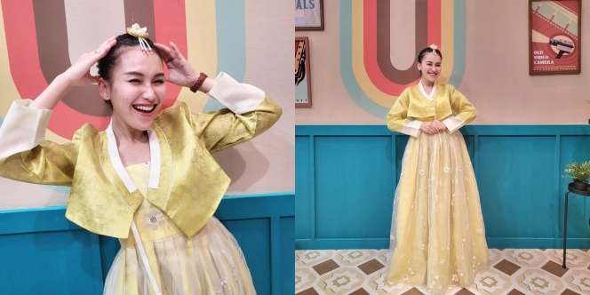 7 Potret Ayu Ting Ting Tampil Anggun dengan Hanbok Emas, Cocok Banget!