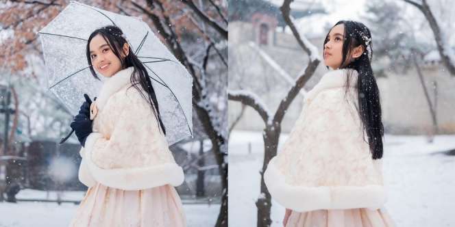 Nikmati Salju di Korea, Lyodra Tampil Stylish dan Hangat dalam Balutan Hanbok