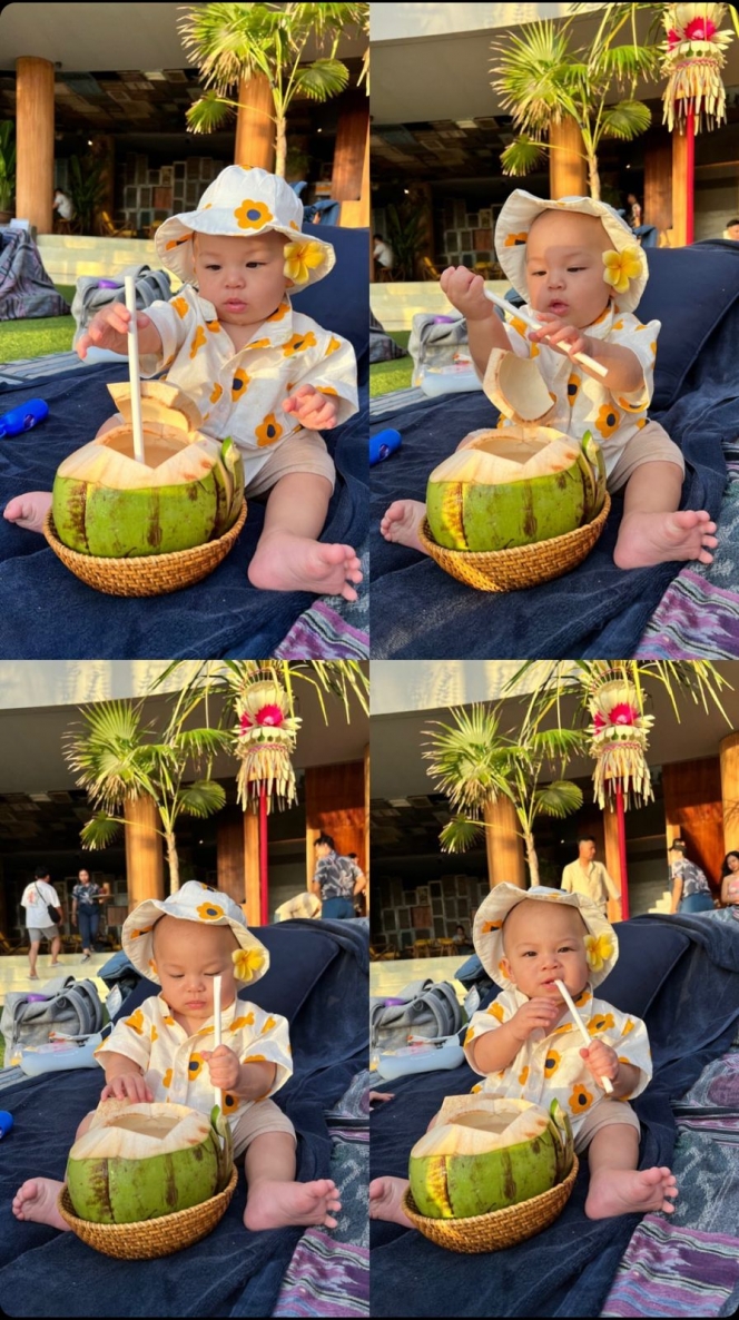10 Potret Gemas Baby Izz Nikmati Sunset di Pantai Bali, Santuy Sambil Minum Es Kelapa Muda!